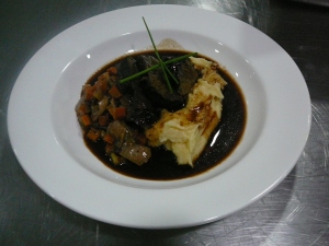 Slow cooked beef cheeks, roasted garlic and parmesan mash